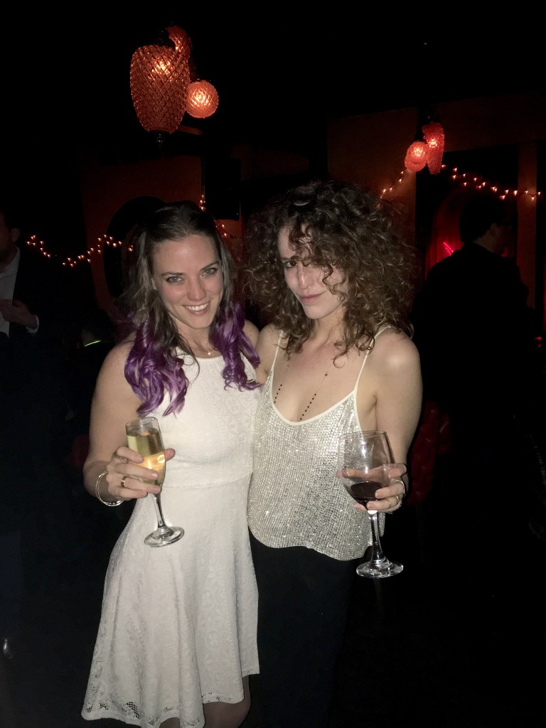 Megan with Jessica, rocking a sequined top and black pants.